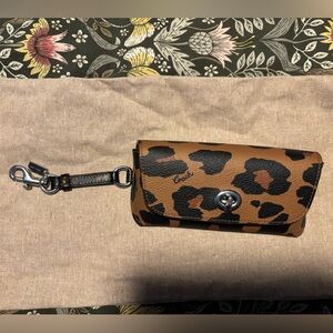 Coach Leopard Print Sunglass Holder with clasp.